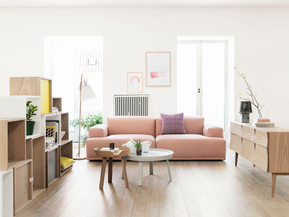 Design ideas for a scandinavian living room in Copenhagen with white walls, light hardwood flooring and beige floors.