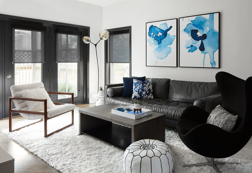 Inspiration for a mid-sized contemporary enclosed dark wood floor and brown floor living room remodel in Chicago with white walls