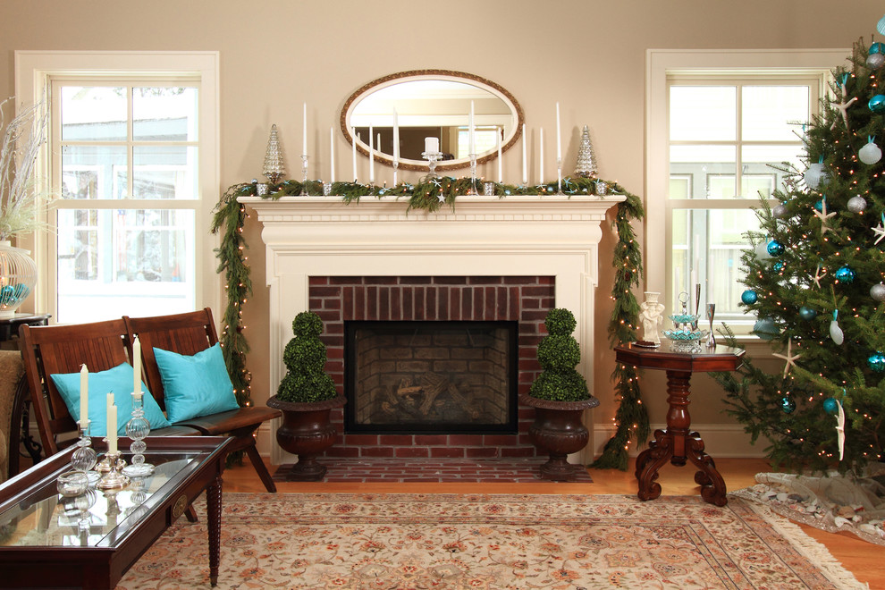 Inspiration for a country medium tone wood floor living room remodel in Minneapolis with beige walls, a standard fireplace and a brick fireplace