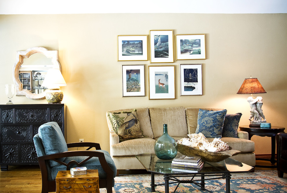 This is an example of a traditional living room in Austin with beige walls.