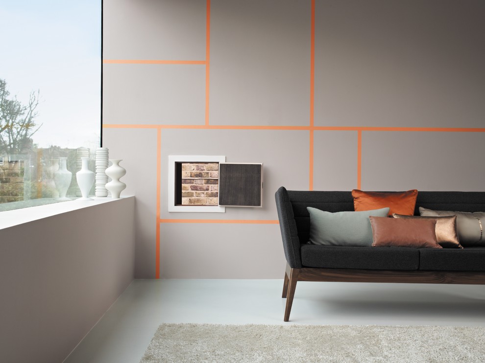 Стильный дизайн: гостиная комната в современном стиле с акцентной стеной - последний тренд