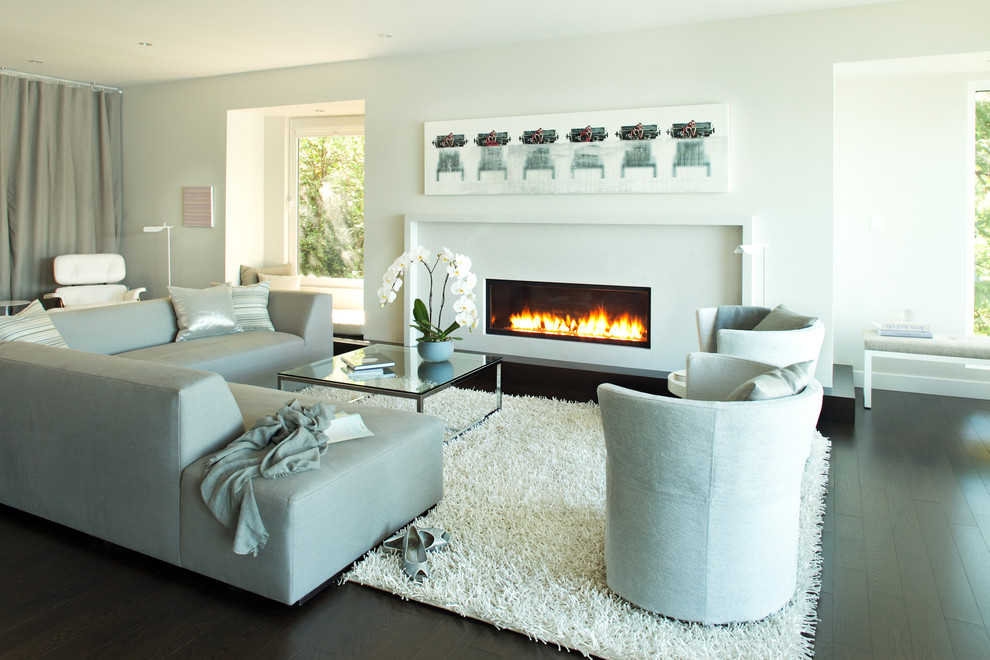 Living room - contemporary living room idea in Vancouver with white walls and a ribbon fireplace