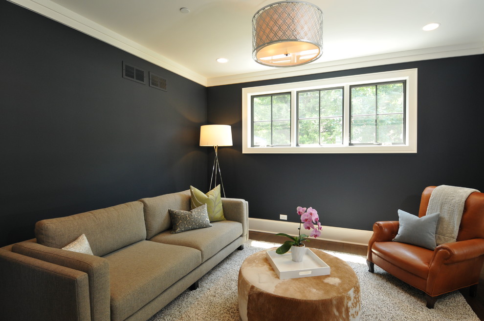 Immagine di un piccolo soggiorno design con pareti blu e parquet scuro