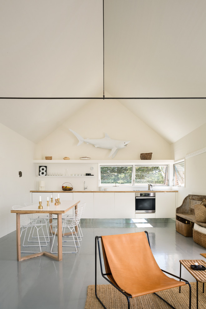 Small mountain style open concept living room photo in Portland Maine with white walls and no fireplace