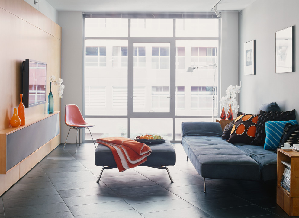 Living room - small contemporary open concept and formal living room idea in Los Angeles with gray walls and a wall-mounted tv