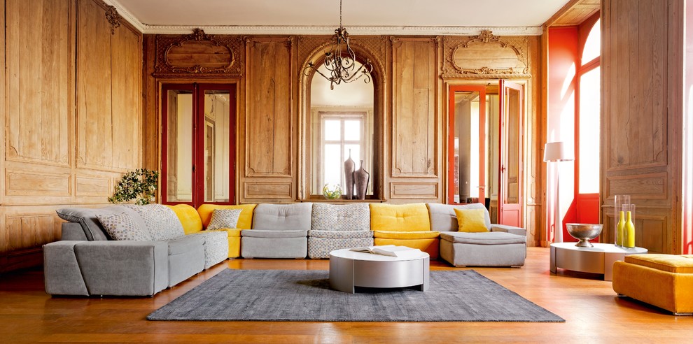 Photo of a contemporary formal and grey and yellow enclosed living room in London with feature lighting.
