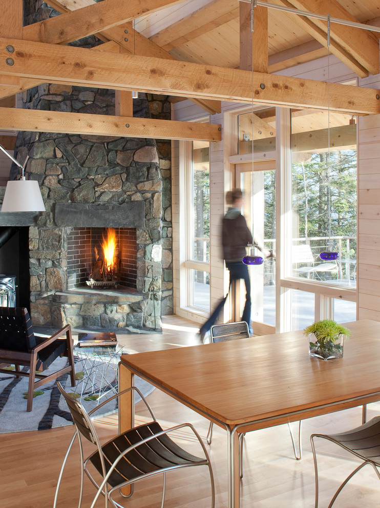 Inspiration for a rustic living room remodel in Portland Maine with a stone fireplace