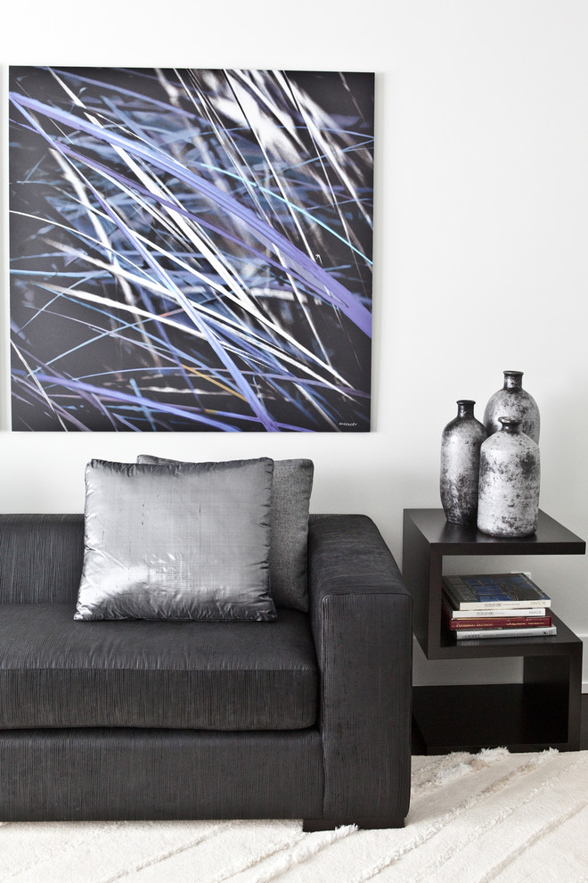 Inspiration for a large modern open concept dark wood floor living room remodel in Toronto with gray walls
