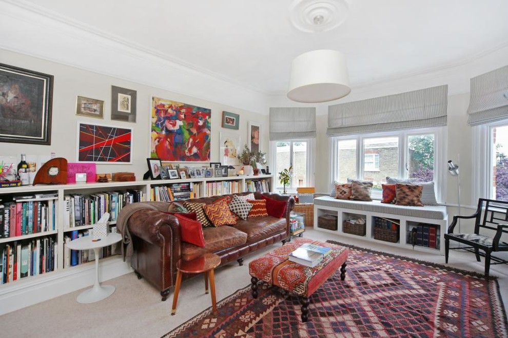 Design ideas for a medium sized eclectic enclosed living room in London with a reading nook and carpet.