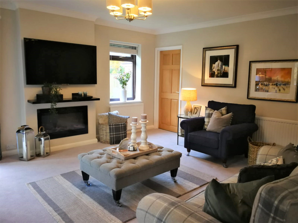 This is an example of a medium sized rural formal enclosed living room in Devon with grey walls, carpet, a standard fireplace, a plastered fireplace surround, a wall mounted tv and grey floors.