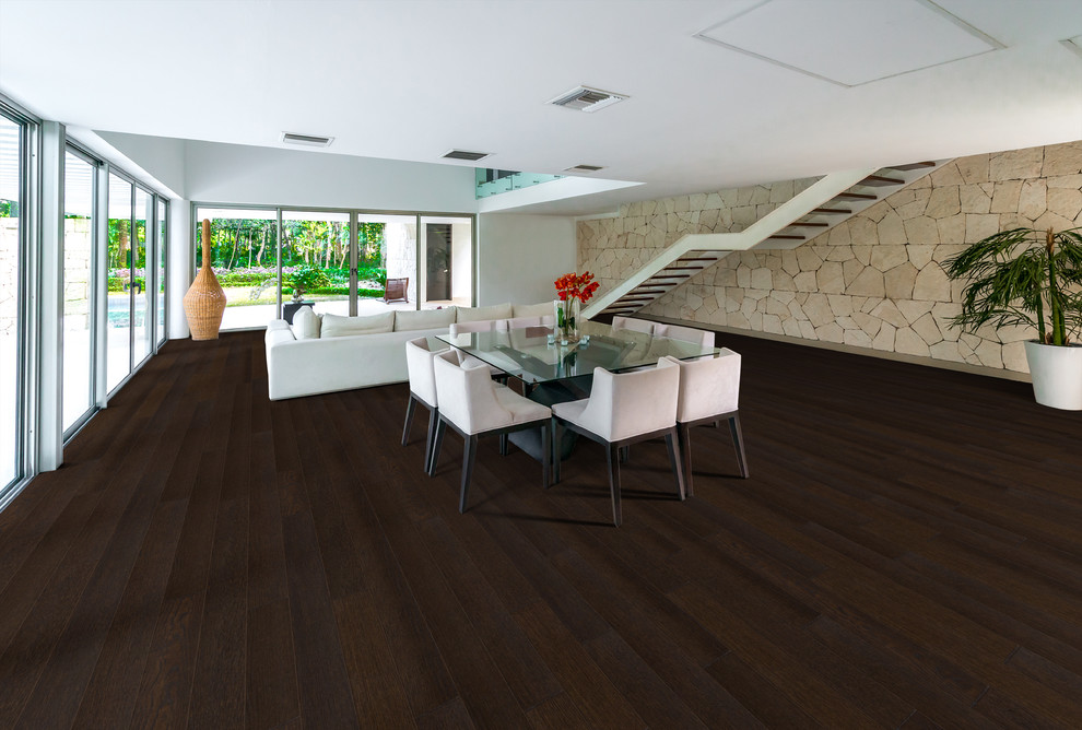 Contemporary dining room in Other with dark hardwood flooring.