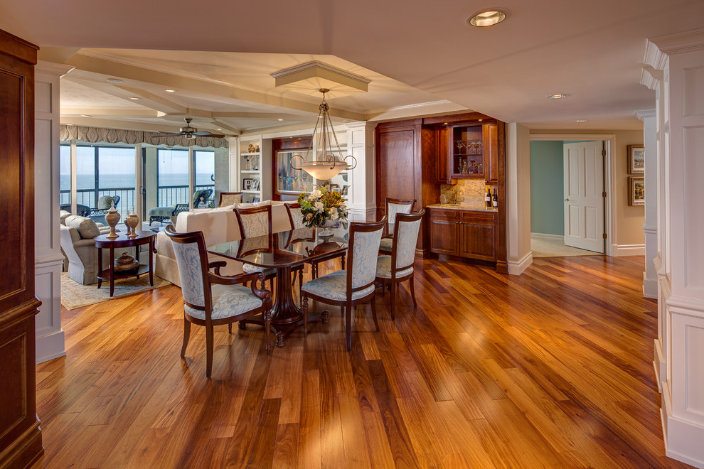Example of a large classic light wood floor dining room design in Other with beige walls