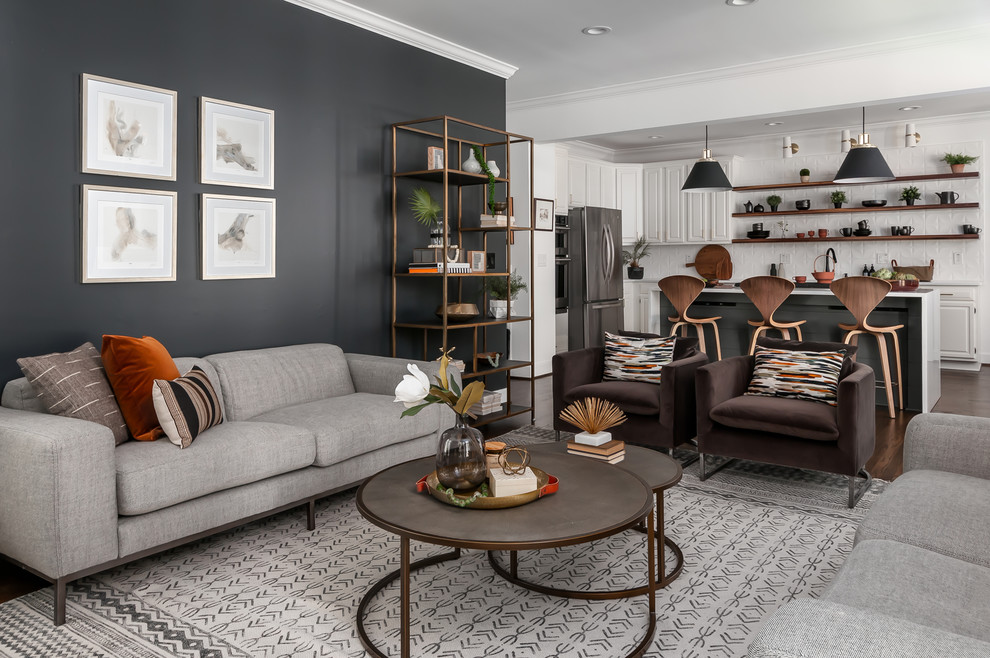Example of a mid-sized danish open concept dark wood floor and brown floor living room design in Atlanta with gray walls, a standard fireplace, a wall-mounted tv and a wood fireplace surround