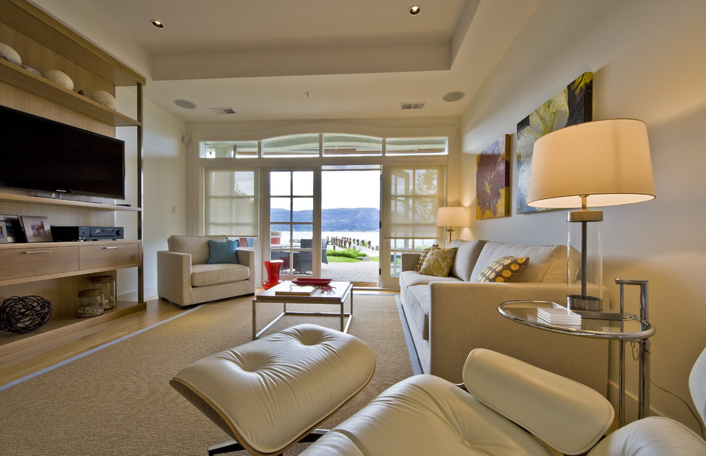 Inspiration for a beach style living room in Vancouver with white walls.