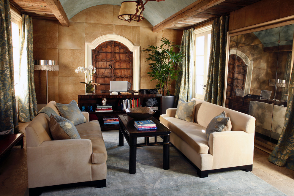 Large tuscan formal and enclosed limestone floor and beige floor living room photo in Orange County with brown walls