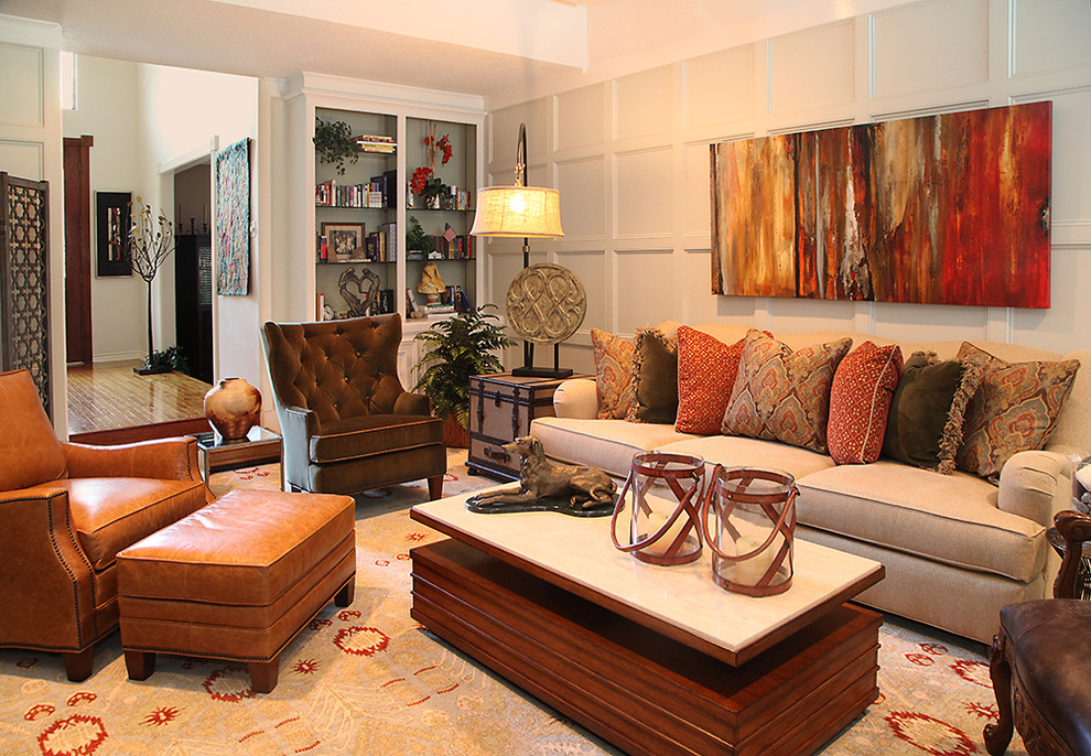 Photo of a bohemian enclosed living room in Houston with grey walls and carpet.