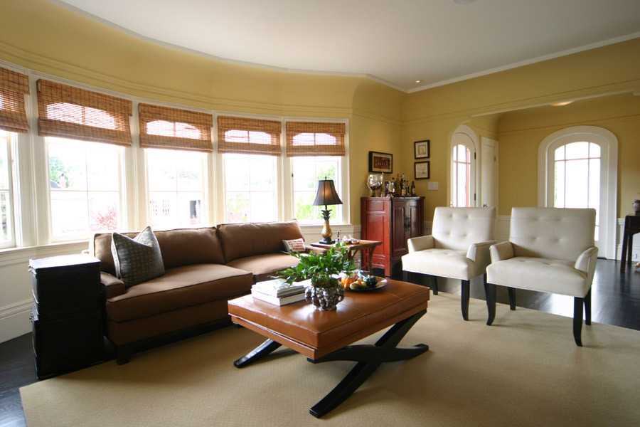 Example of a large classic formal and open concept dark wood floor living room design in San Francisco with yellow walls and no fireplace