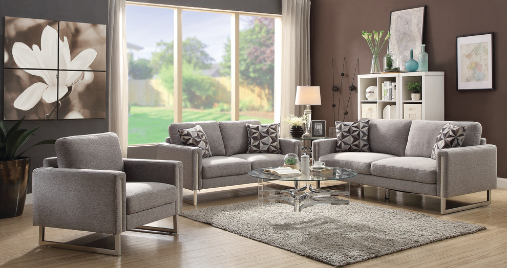 Immagine di un soggiorno minimal di medie dimensioni e chiuso con pareti viola, pavimento in laminato e pavimento beige