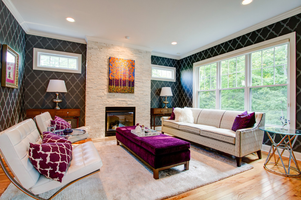 Inspiration for a mid-sized contemporary formal and enclosed light wood floor living room remodel in New York with black walls, a standard fireplace and a stone fireplace