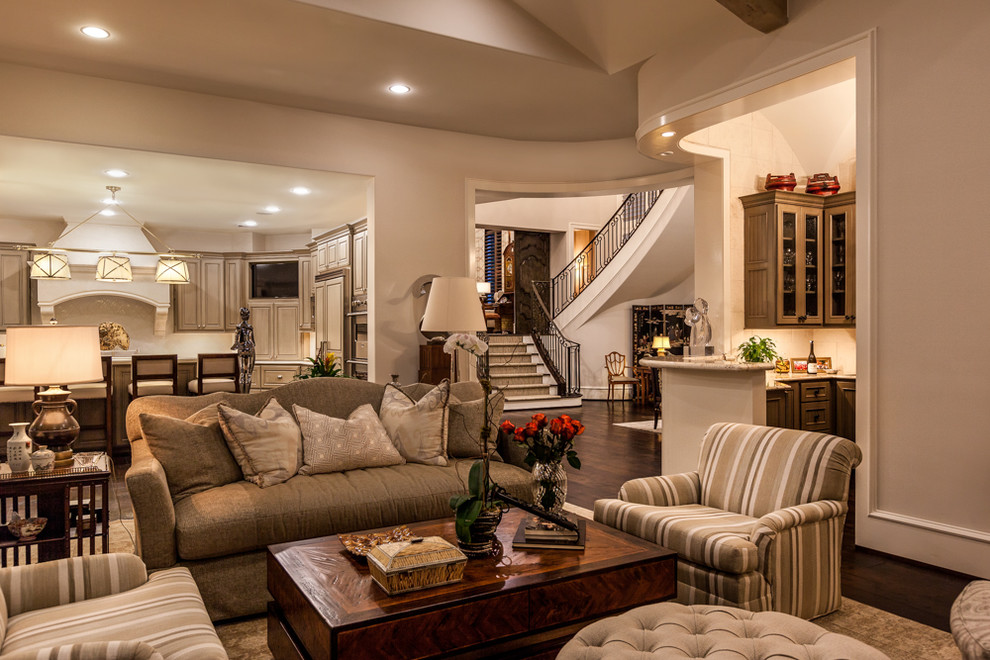 This is an example of a large classic formal living room in Houston with beige walls.