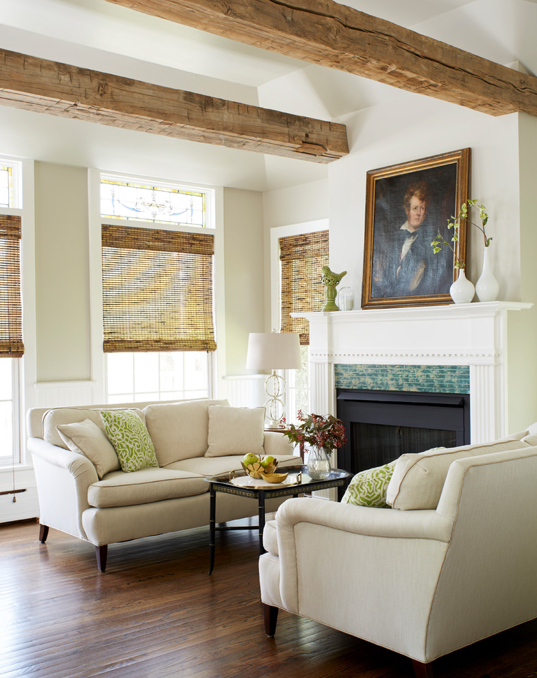 Inspiration for a mid-sized timeless open concept dark wood floor and brown floor living room remodel in New York with beige walls, a standard fireplace, a tile fireplace and no tv