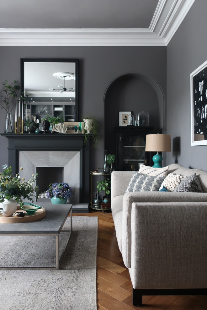 This is an example of a medium sized contemporary grey and black living room in Other with grey walls, medium hardwood flooring, brown floors and feature lighting.