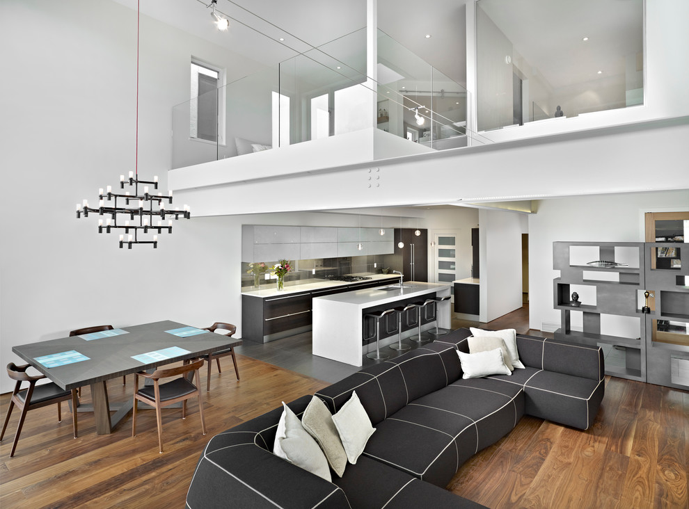 Свежая идея для дизайна: открытая гостиная комната в стиле модернизм с белыми стенами - отличное фото интерьера