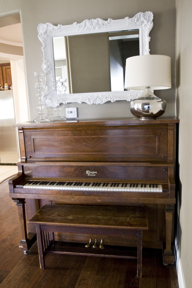 Eclectic living room in Salt Lake City with a music area and beige walls.