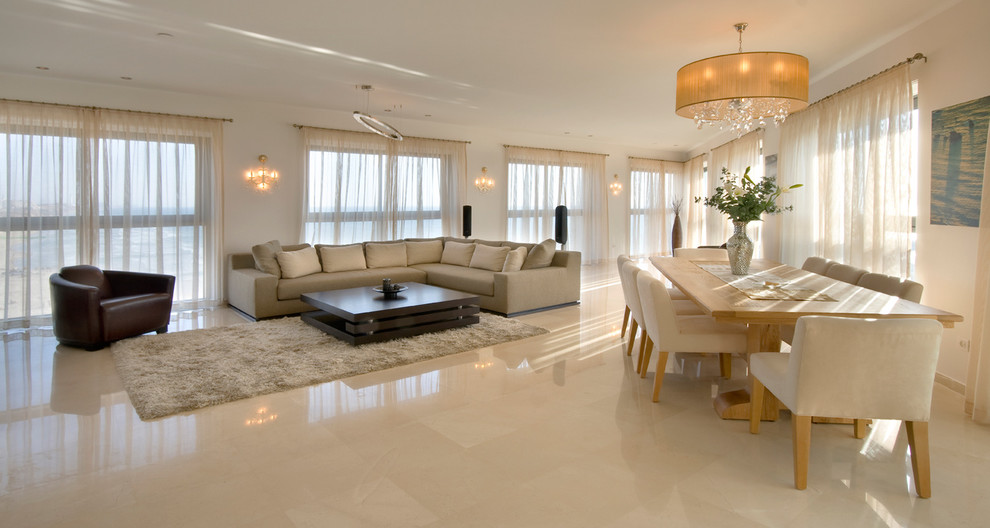 Example of a trendy open concept beige floor living room design in Other