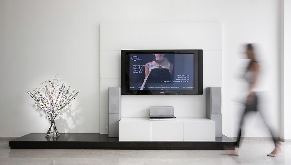 Example of a trendy living room design in Other with a wall-mounted tv