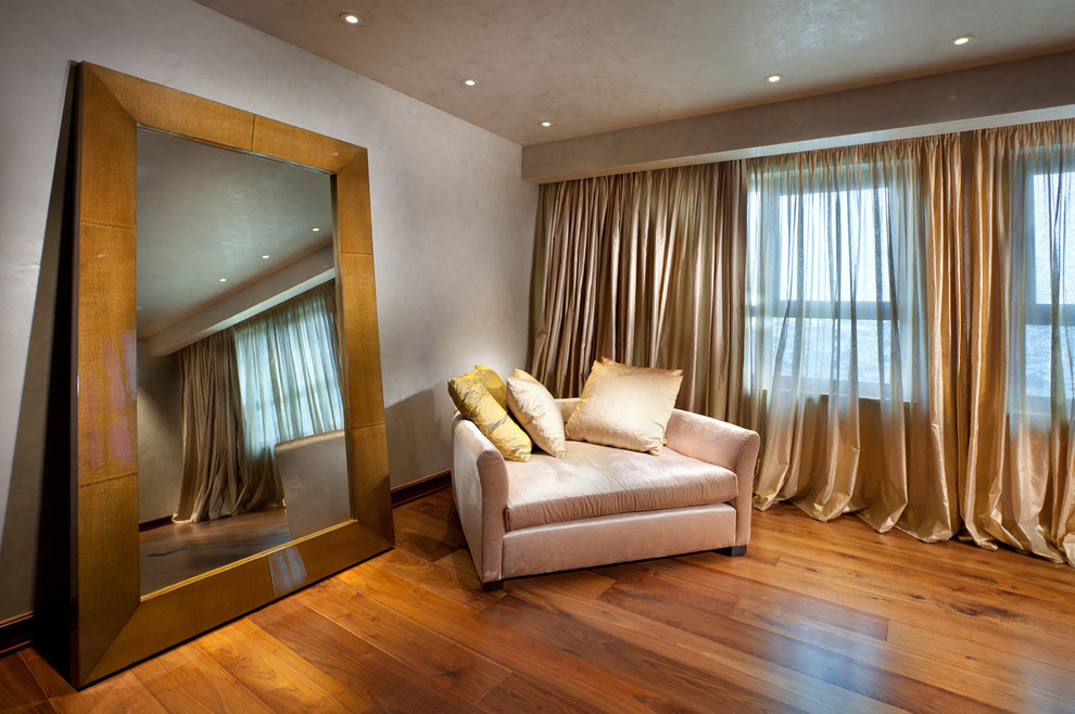 Example of a trendy living room design in Other with gray walls