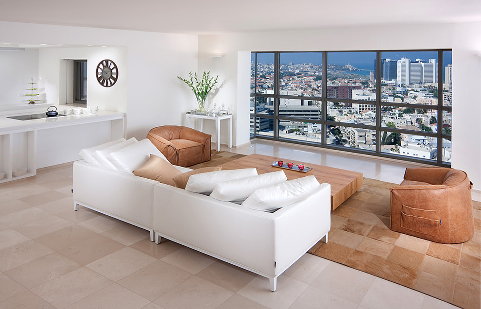 Esempio di un soggiorno design aperto con pareti bianche