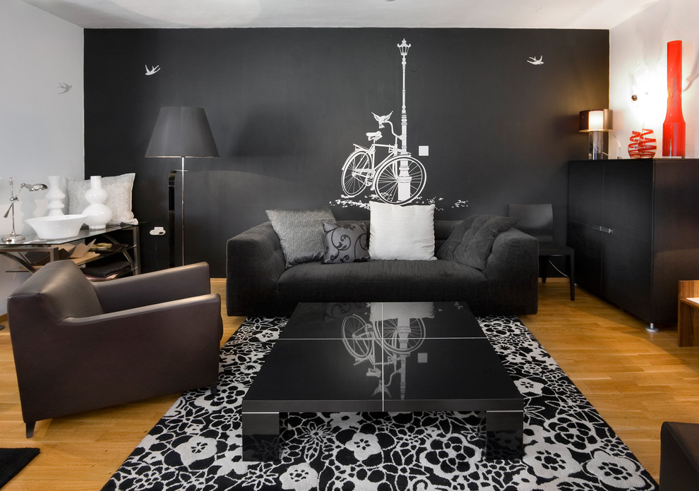 Living room - contemporary living room idea in Other with black walls