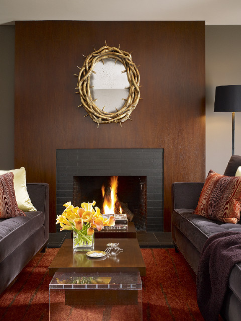 This is an example of a contemporary living room in San Francisco with a standard fireplace.