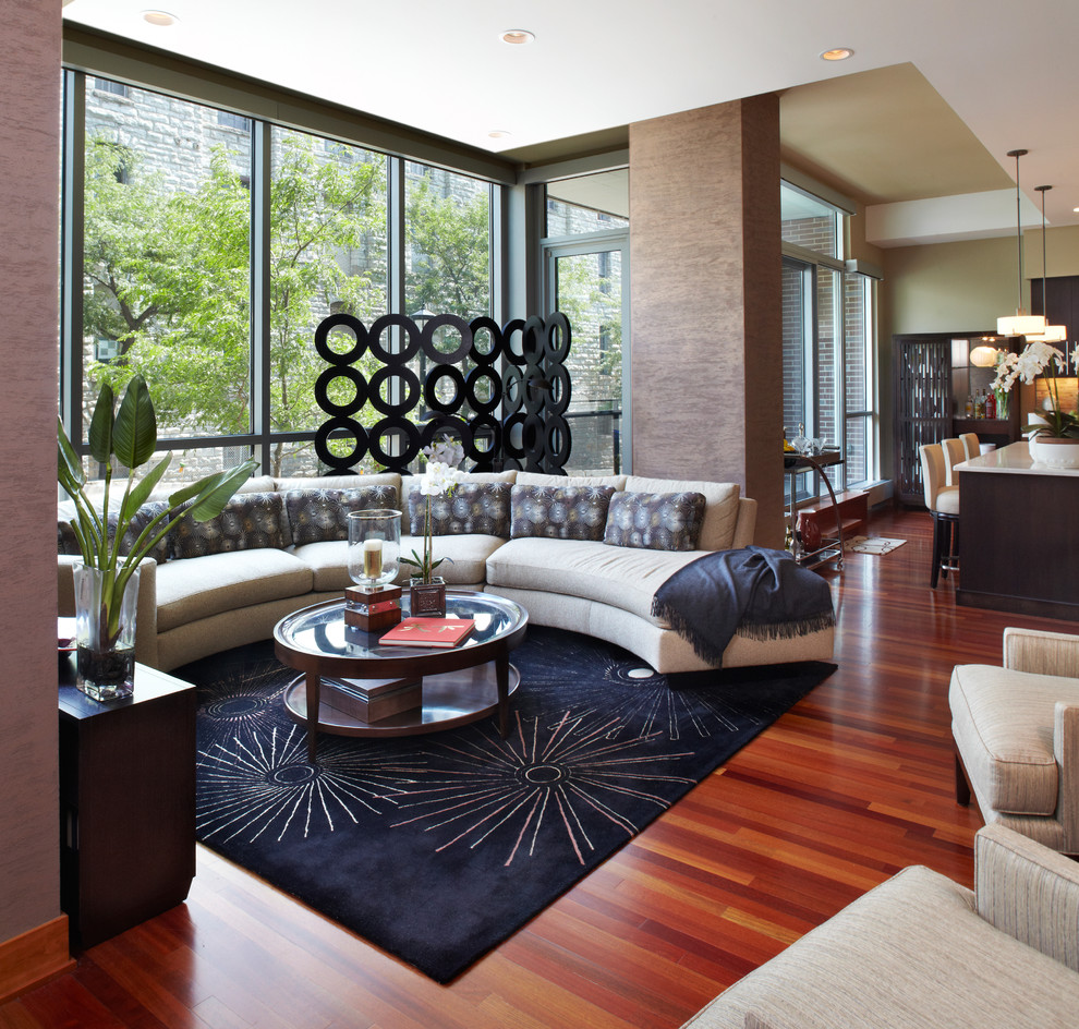 Пример оригинального дизайна: открытая гостиная комната в современном стиле с красным полом без телевизора