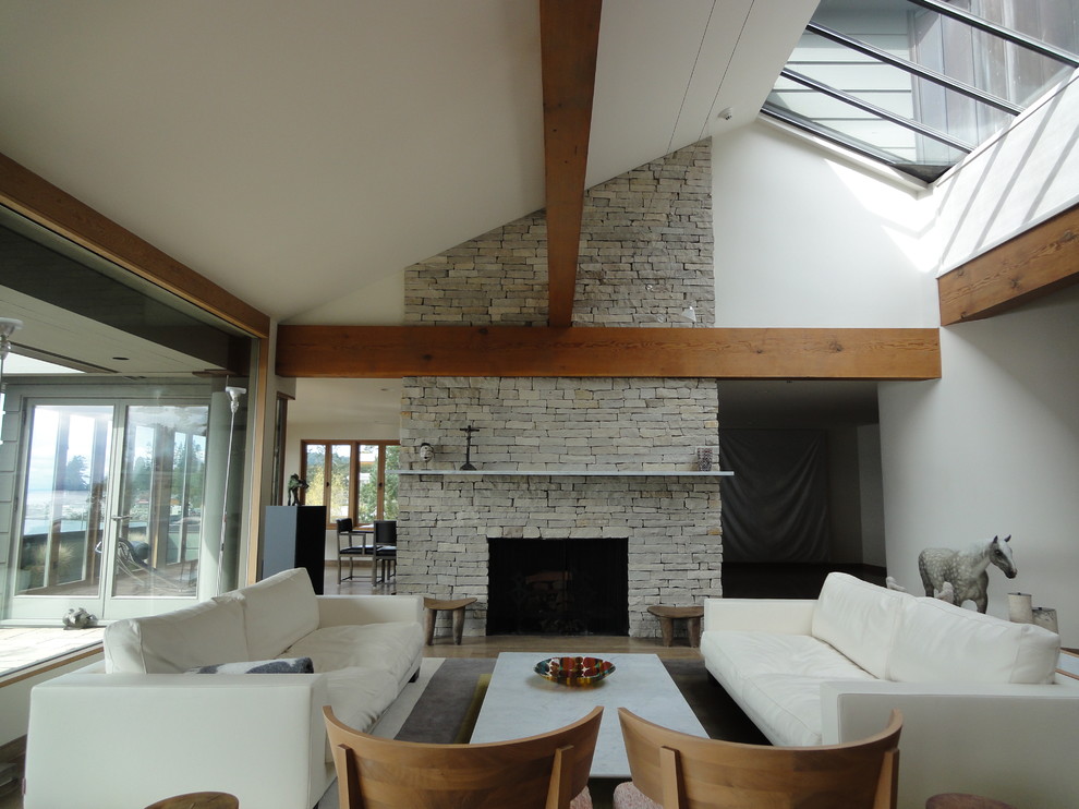 Inspiration for an eclectic living room remodel in Vancouver with white walls, a standard fireplace and a stone fireplace