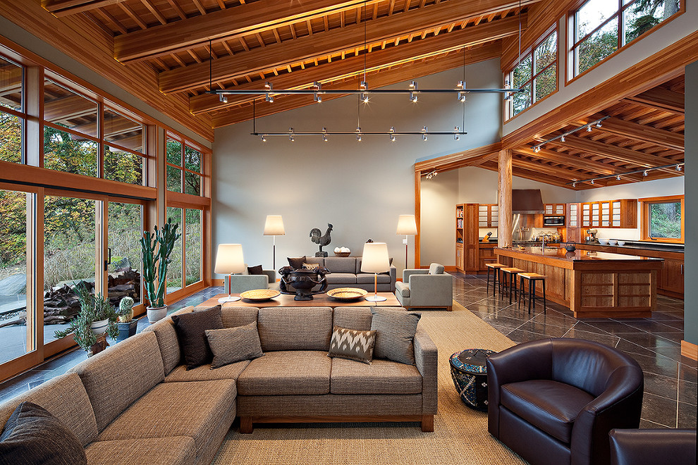 Photo of a large contemporary living room in Seattle with grey walls and feature lighting.