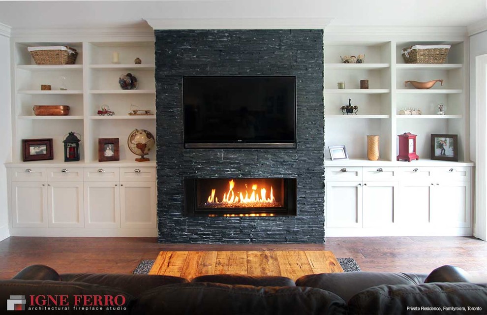 Example of a minimalist living room design in Toronto with a standard fireplace and a tile fireplace