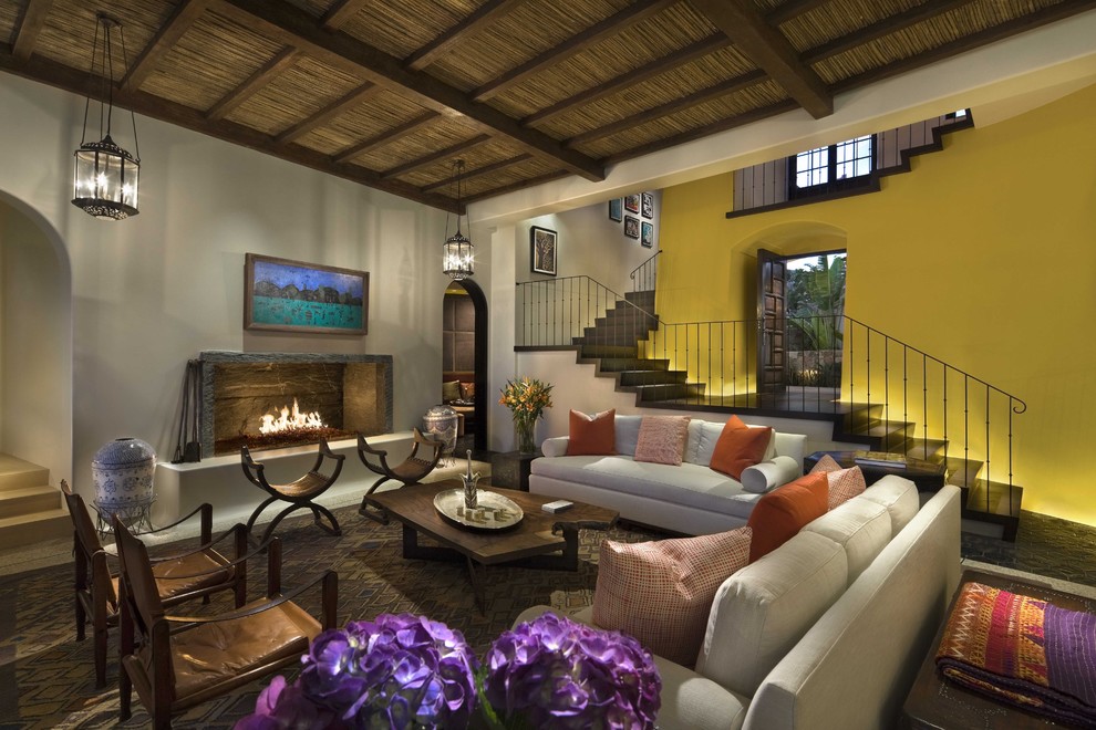Design ideas for a world-inspired living room feature wall in Mexico City with yellow walls.