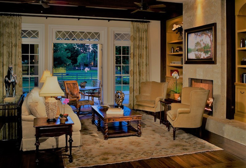 Large elegant dark wood floor and brown floor living room photo in Tampa with a standard fireplace
