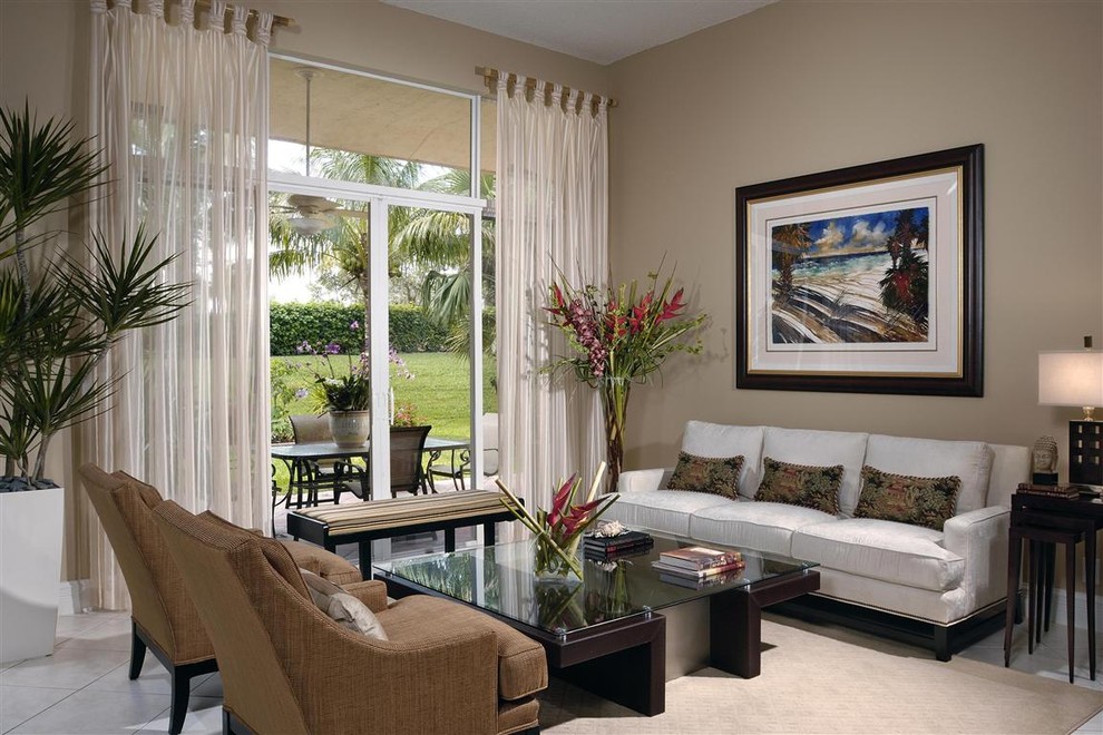 Living room - contemporary living room idea in Miami with beige walls