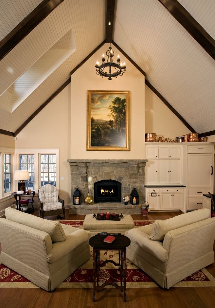 Classic living room in Minneapolis with a standard fireplace and a stone fireplace surround.