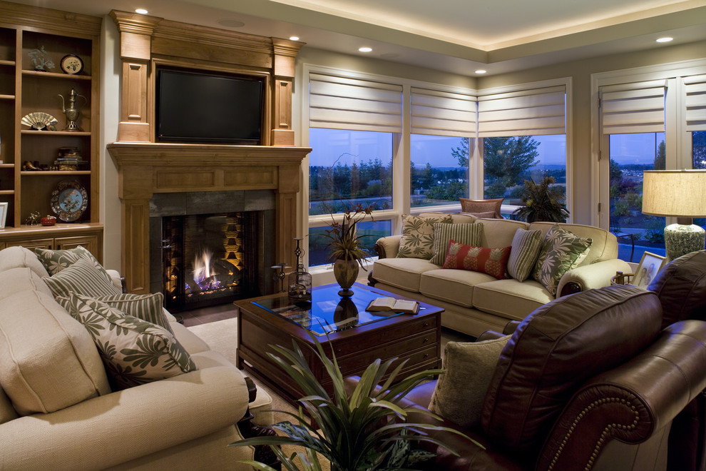 Example of a trendy living room design in Portland with a standard fireplace and a wall-mounted tv