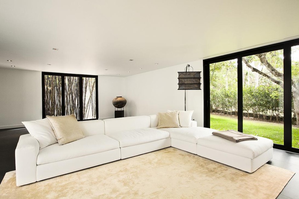 Design ideas for a large contemporary enclosed living room in Miami with white walls and no tv.