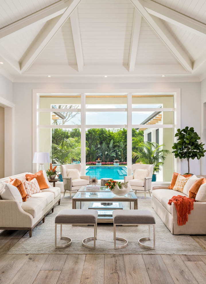 Photo of a world-inspired living room in Other with grey walls, medium hardwood flooring and brown floors.