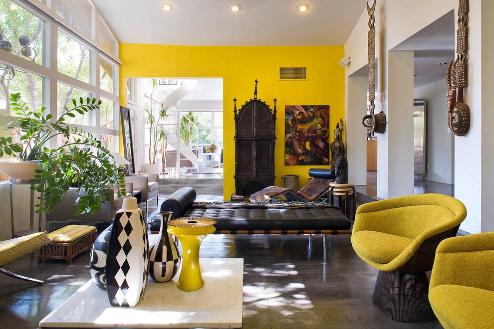 Living room - eclectic concrete floor living room idea in Portland with yellow walls