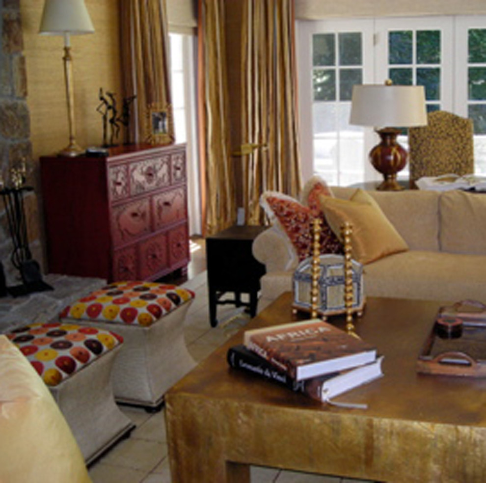 На фото: парадная, открытая гостиная комната среднего размера в стиле неоклассика (современная классика) с желтыми стенами, паркетным полом среднего тона, стандартным камином и фасадом камина из камня без телевизора