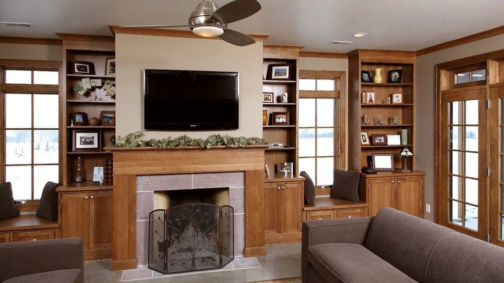 Inspiration for a large craftsman formal and open concept concrete floor living room remodel in Other with beige walls, a standard fireplace, a wall-mounted tv and a wood fireplace surround