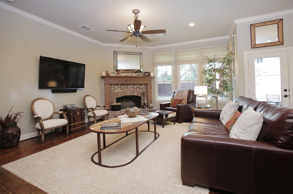 Mountain style living room photo in Dallas with a brick fireplace and a corner fireplace