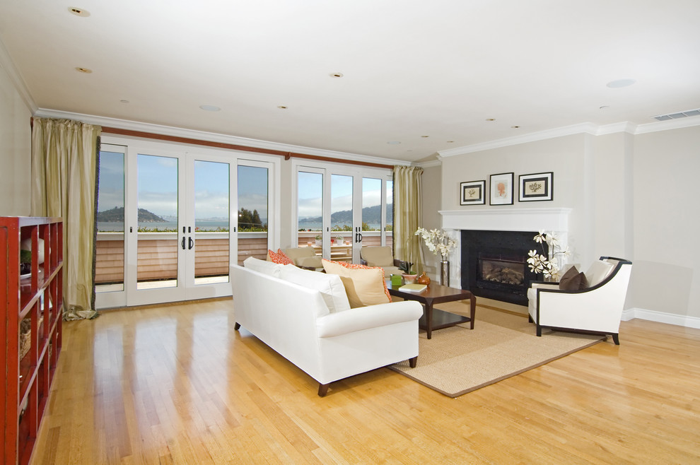 Photo of a large beach style living room curtain in San Francisco with a standard fireplace and no tv.